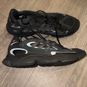 all-black Adidas Ozmillen sneakers featuring Adiplus cushioning